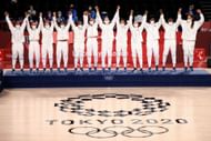 United States celebrates on the medal stand during the Women's Basketball medal ceremony at the 2020 Tokyo Olympic Games. (Photo by Mike Ehrmann/Getty Images)